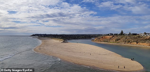 The young boy was swimming in the river mouth when he was caught in a tidal current, in Port Noarlunga, South Australia.